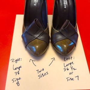 These green tone patent leather shoes by Audley are two different sizes.